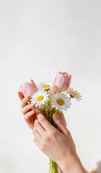 Gentle Hands Holding Fresh Spring Flowers