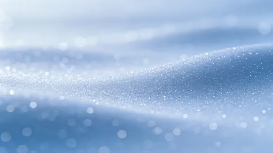 Ethereal Shimmering Blue Snow Bokeh Background
