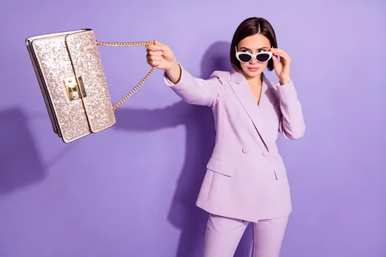 Woman In A Suit Holding A Purse