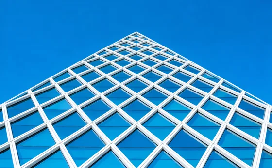 Tall Building With Blue Sky In The Background