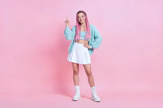 Woman In A White Skirt And A Green Cardigan Jacket