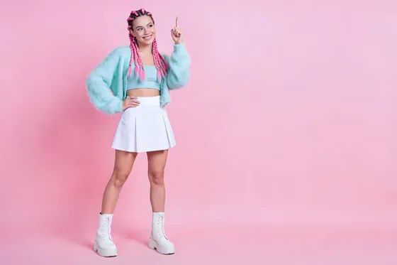 Woman In A White Skirt And A Turquoise Jacket