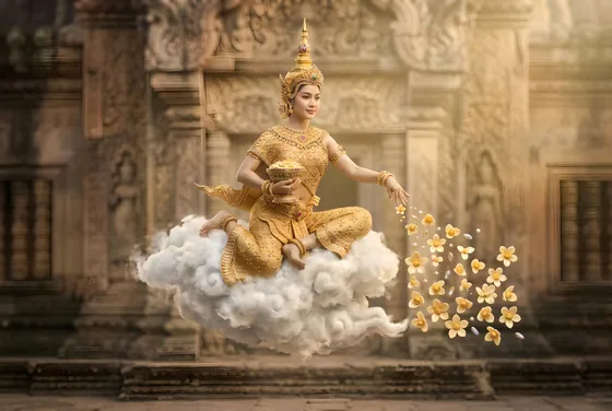 Khmer celestial dancer scattering flowers from a cloud
